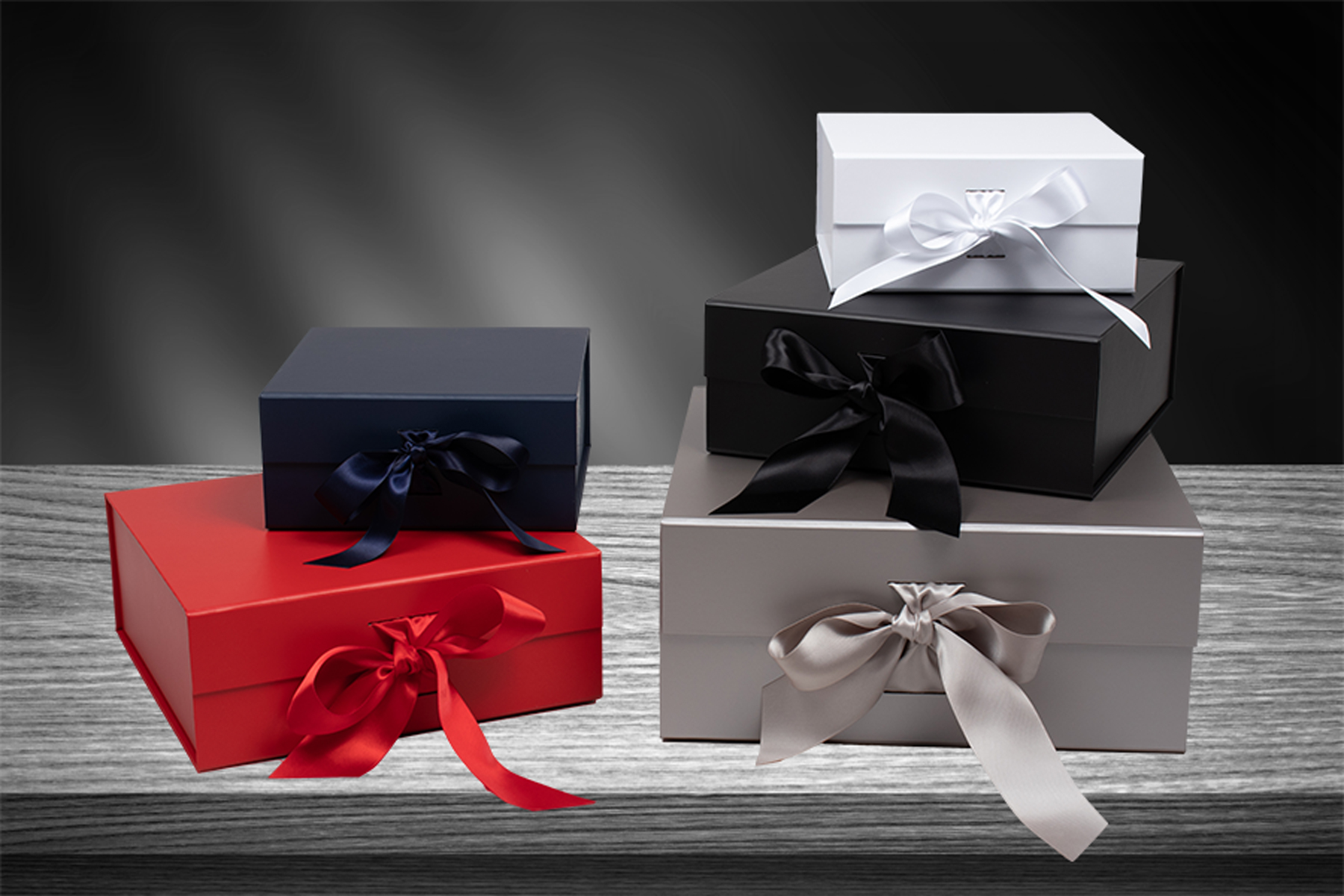 Magnetic lid gift boxes with ribbon tied closure